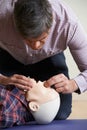 Man In First Aid Class Performing Mouth To Mouth Resuscitation O Royalty Free Stock Photo