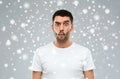 Man with fish-face over snow background