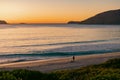 Man fishing on the beach, early morning at Jimmy\'s Beach at Hawk\'s Nest, NSW Australia