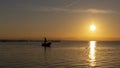 Man fishing in a boat at sunset in Albufera of Valencia Royalty Free Stock Photo