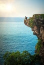 Man fishing on edge of cliff on the Indian coast