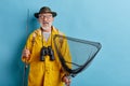 Man with fishing equipment going to rest on the banck of the river