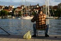 Man fishing with fishing line in Trogir town