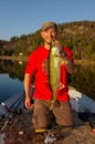 Man Fishing Holding Walleye Royalty Free Stock Photo