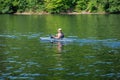 Man fishing in a kayak on Cheat Lake in Morgantown, West Virginia, USA