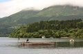 Man fishing on lake Ashinoko, Hakone, Japan