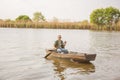 Man fishing on a lake- Fisherman in fishing boat Royalty Free Stock Photo