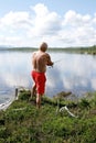 Man fishing by a lake