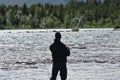 Man fishing by the lake in the Nordics