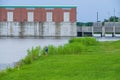 Man Fishing in the London Avenue Canal with Flood Gates and Pump Station in Background