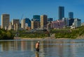 Man fishing in North Saskatchewan river in area of downtown Edmonton.