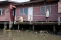 Man fishing River Houses, Bangkok, Thailand