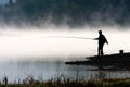 Man fishing at river shore