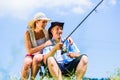 Man with fishing rod angling at lake enjoying hug Royalty Free Stock Photo