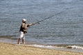 Man fishing in the Chesepeake Bay at Sandy Point in Maryland