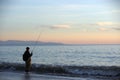 A man fishing at sunset Royalty Free Stock Photo