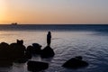 Man fishing at sunset, Tombeau Bay, Mauritius Royalty Free Stock Photo