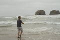 Man fishing in the surf on Rockaway beach