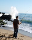 Man fishing and whaching wave Royalty Free Stock Photo