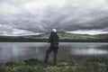 Man is fishing in the wilderness of the Arctic mountains