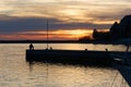 Man Fishing during a Winter Sunset at Sistiana Bay Royalty Free Stock Photo