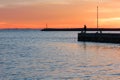 Man Fishing during a Winter Sunset at Sistiana Bay Royalty Free Stock Photo