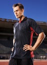 Man, fitness and confident soccer player in stadium, athlete and competitive for match or game. Male person, serious