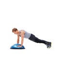 Man, fitness and half ball for plank in studio for training, strong exercise and gym with muscle health on floor. Person