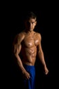 Man fitness no shirt on black side light look Royalty Free Stock Photo