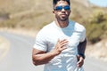 Man, fitness and running in nature for exercise, cardio workout or training outdoors. Fit, active and sporty male person Royalty Free Stock Photo