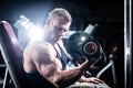Man at fitness training with dumbbells in gym Royalty Free Stock Photo