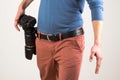 Man fixed a camera in his belt Royalty Free Stock Photo