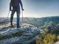 Man with fixed leg makes step with help of forearm crutches