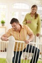 Man Fixing Baby Bed