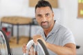 Man fixing bike wheel in store Royalty Free Stock Photo