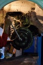 Car mechanic repairing brakes disc on car, indoor repair service Royalty Free Stock Photo