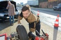 Man fixing car problem after vehicle breakdown Royalty Free Stock Photo