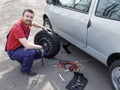 Man fixing a car problem after vehicle breakdown Royalty Free Stock Photo