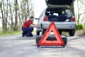 Man fixing a car problem after vehicle breakdown Royalty Free Stock Photo