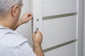 Man changing the door lock at home Royalty Free Stock Photo