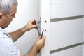 Man changing the door lock at home Royalty Free Stock Photo