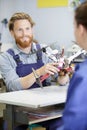 Man fixing drone in service laboratory