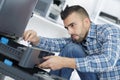 Man fixing electronic circuits