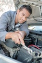 Man fixing engine Royalty Free Stock Photo