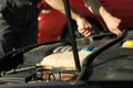 Man fixing engine. Car inspection Royalty Free Stock Photo