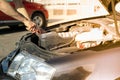 Man fixing engine Car inspection. Work of mechanic Royalty Free Stock Photo