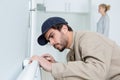 Man fixing heating radiator