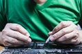 Man fixing laptop computer