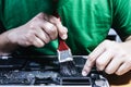 Man fixing laptop computer