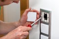 Man fixing the light switch Royalty Free Stock Photo